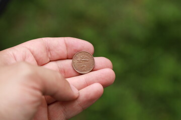 Greek change coin in hand