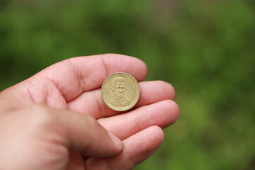 Greek change coin in hand
