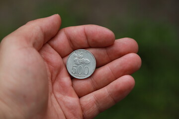 Indonesian change coin in hand