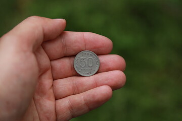 Indonesian change coin in hand
