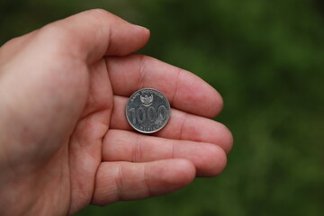 Indonesian change coin in hand