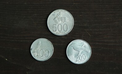 Indonesian change coin on wooden table