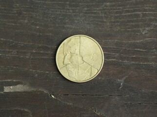 Belgian change coin on a wooden table