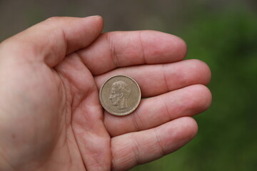 Belgian change coin in hand