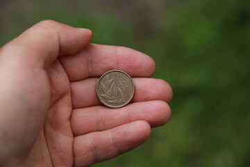 Belgian change coin in hand