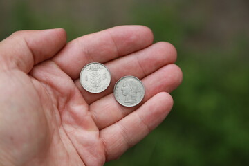Belgian change coin in hand