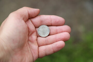 Belgian change coin in hand