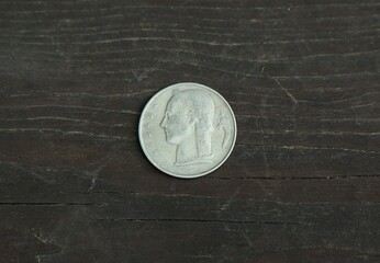 Belgian change coin on a wooden table