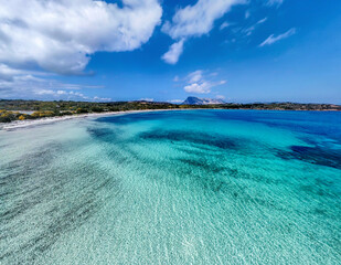 Aerial view of Lu Impostu beach turquoise water in springtime