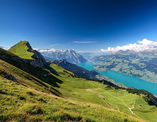 Obraz premium scenic view from the schynige platte panoramic ridge walking trail hike with lake brienz in switzerland in the bernese highlands green meadows and swiss mountains on a sunny day