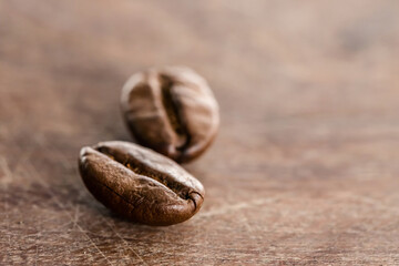 Coffee beans on grunge wooden background