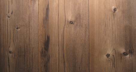Fototapeta premium Wooden surface with a grain pattern. The surface is brown in color. texture background for template pages and banners