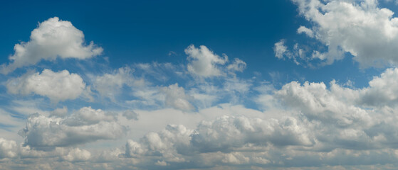 heaven sky is blue with many clouds. clouds are scattered throughout the sky and are of various...