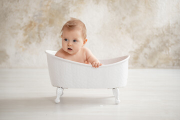 baby bathes or washes in a bubble bath, baby hygiene, a place for text
