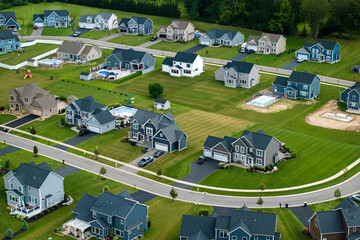 Aerial view of spacious new family houses in upstate New York suburban area. Real estate...