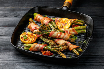 Grilled Bacon Wrapped Asparagus in iron cast pan