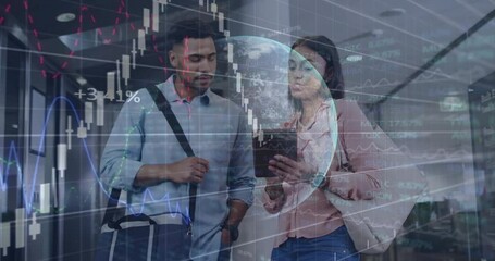 Colleagues tapping tablet, exploring holographic globe with financial charts tracking market trends