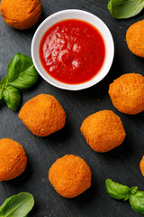 Arancini Rice Balls. Crispy, deep fried rice balls stuffed with mozzarella cheese