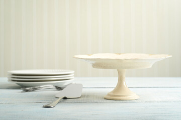 empty beige cake stand and plate set