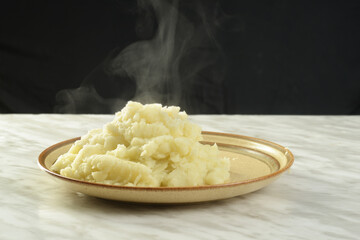 plate of hot steaming mash potatoes