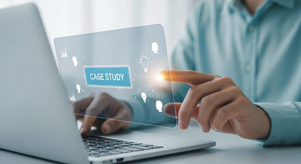 Man interacting with case study interface on laptop screen in a bright modern office setting indoors
