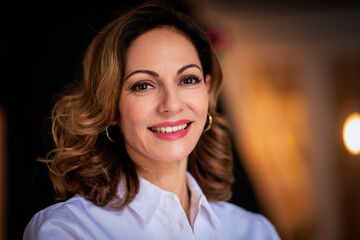 Portrait of an attractive middle aged woman smiling at camera