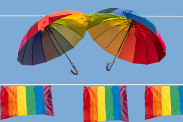 Umbrellas and rainbow flags against a blue sky decorate a street in Madrid, Spain.