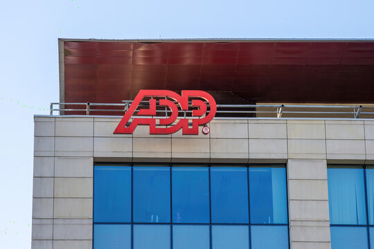 ADP (Automatic Data Processing) logo displayed on the facade of an office building. ADP (NASDAQ: ADP) is a global provider of human capital management solutions.