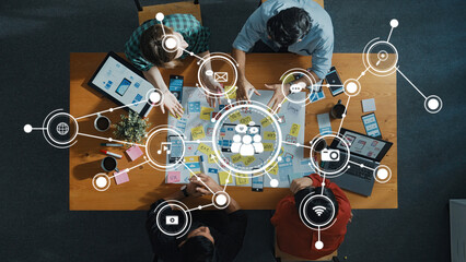 A vibrant overhead view of a collaborative brainstorming session showcasing diverse individuals...