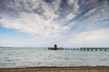 Pier and lighthouse on the sea, Lignano Sabbiadoro, Italy