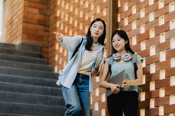 Two Asian Students Exploring University Campus