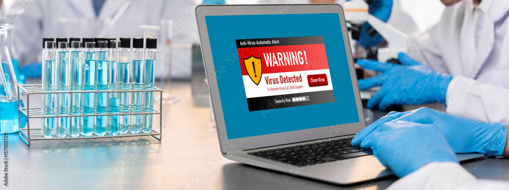 Poster virus warning alert on computer screen detected brisk cyber threat , hacker, computer virus and malw