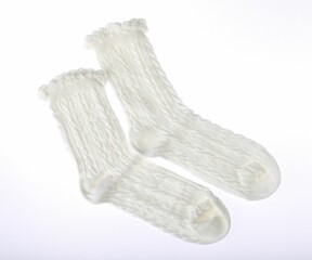 Pair of comfortable socks isolated on white, top view