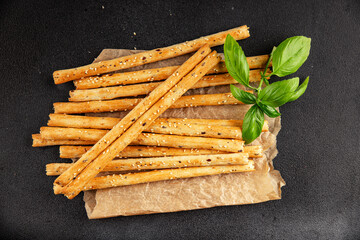Grissini breadsticks whole grain cereal fresh delicious gourmet food background on the table rustic food top view copy space