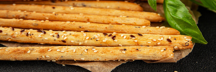 Grissini breadsticks whole grain cereal fresh delicious gourmet food background on the table rustic food top view copy space