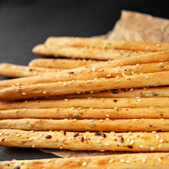 Grissini breadsticks whole grain cereal fresh delicious gourmet food background on the table rustic food top view copy space