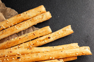 Grissini breadsticks whole grain cereal fresh delicious gourmet food background on the table rustic food top view copy space