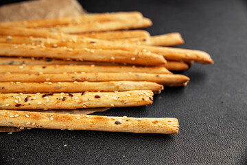 Grissini breadsticks whole grain cereal fresh delicious gourmet food background on the table rustic food top view copy space