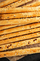Grissini breadsticks whole grain cereal fresh delicious gourmet food background on the table rustic food top view copy space