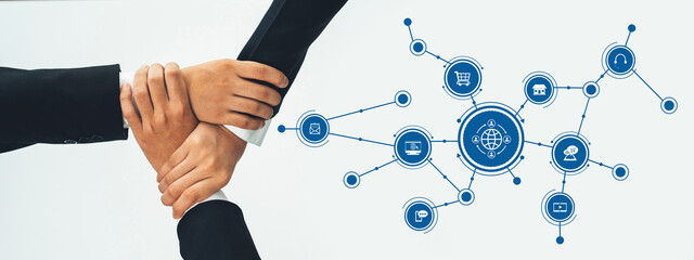 Two hands meet in a symbolic gesture of partnership, surrounded by digital icons that represent...