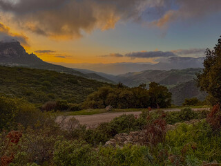 A colorful landscape created just after the sun set behind the mountain.