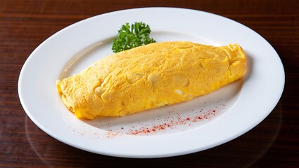 A perfectly cooked golden omelet garnished with fresh parsley and sprinkled with paprika on a white plate