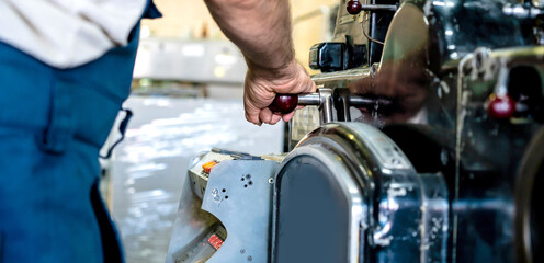 close up engineer hand finger press button controling cnc machine, Workers operating factory...