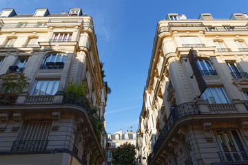 Paris, typical facade and windows, beautiful building, with old zinc roofs