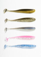 Plastic silicone bait for fishing hook on light background