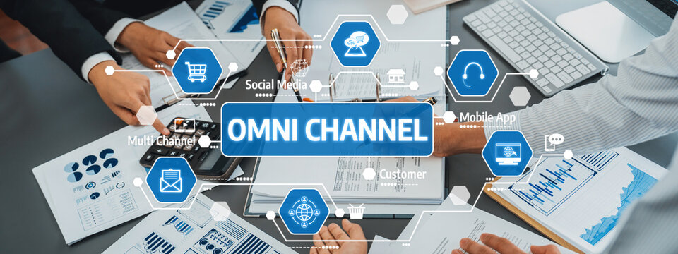A vibrant scene capturing a collaborative business meeting focused on developing an omni channel strategy, highlighting teamwork and digital marketing insights. Amity