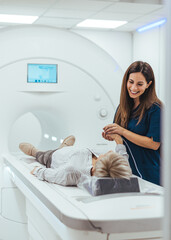 Healthcare Professional Assisting Patient During MRI Scan in Modern Medical Facility