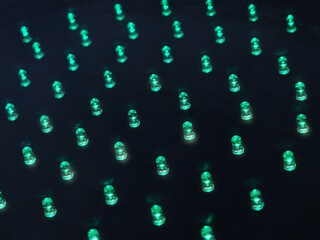 Multiple glowing green led lamps background