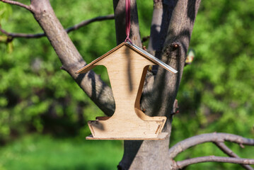 Bird feeder on a tree.