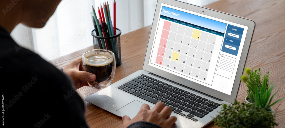 Poster calendar on computer software application for modish schedule planning for personal organizer and on